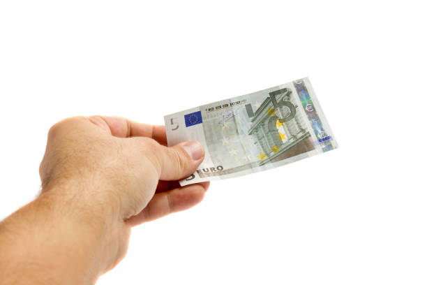 man hand holding 5 euro man hand holding 5 euro five euro banknote photos stock pictures, royalty-free photos & images