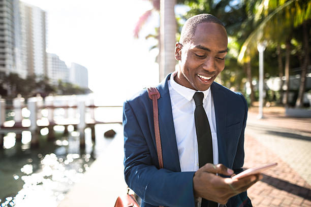 istock businessman texting in miami 638603280