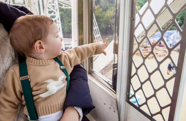 istock Baby boy in the ferris wheel cabin 638603322