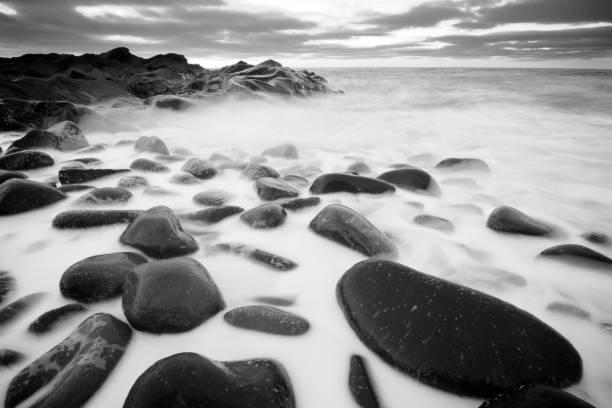 istock foam, sea and rocks 638603726