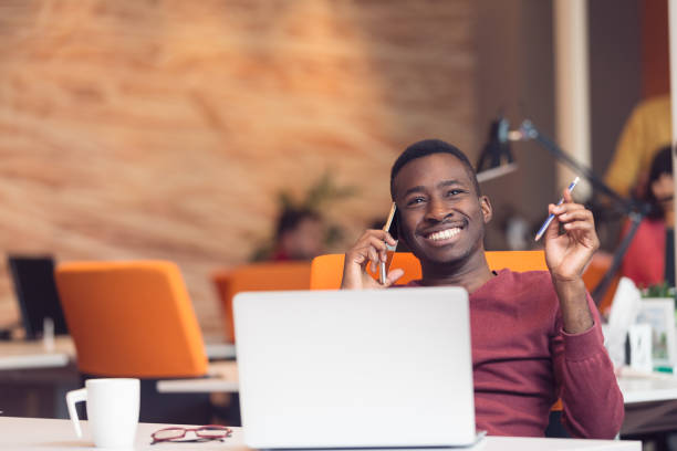 istock African American businessman sitting at the computer in startup office 638604086