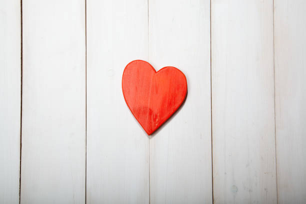 istock Heart on a white wooden background 638611296