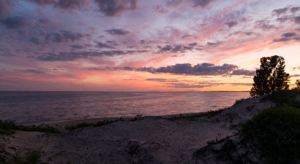 istock Sunset on top of a sand dune at the beach 638613472