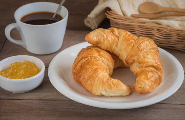 istock Croissants with coffee cup and fruit jam 638614350