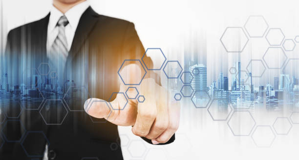 istock Businessman pointing finger to screen, with technology graphic 638614368