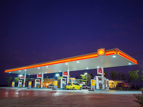 Nakhon Ratchasima, Thailand - December 29, 2016: Shell gas station blue sky background during sunset. Royal Dutch Shell sold its Australian Shell retail operations to Dutch company Vitol in 2014