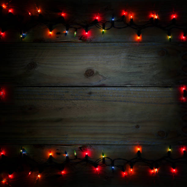 istock christmas light background, colorful light on dark wood 638615110