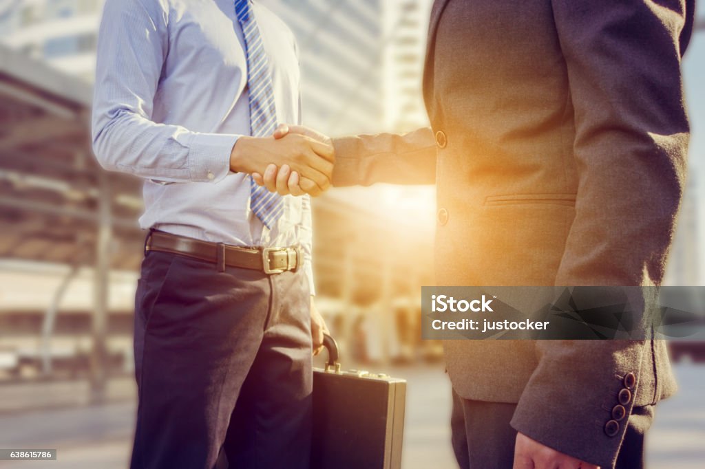 Success and Happiness concept, Businessman handshake at city outside office. Success and Happiness concept, Business man handshake at city outside office. Handshake Stock Photo