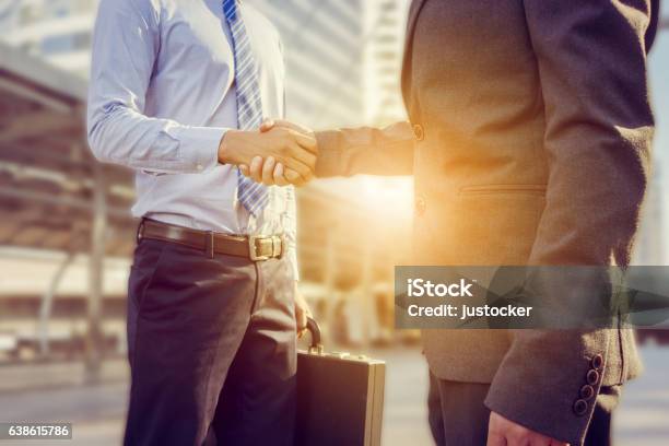 Success And Happiness Concept Businessman Handshake At City Outside Office Stock Photo - Download Image Now
