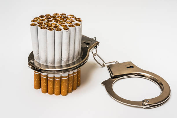 istock Cigarettes and handcuffs - smoking addiction concept 638618774