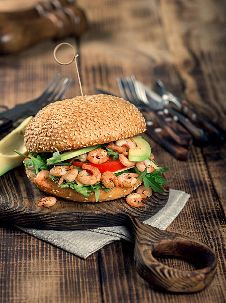istock Burger with prawns grilling on a wooden board 638618794