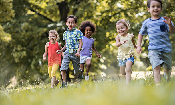 istock Playful kids feeling free while running in the park. 638621030