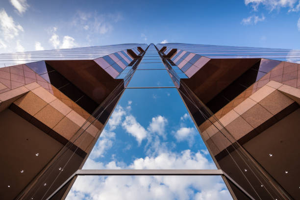 Stunning low angles of office buildings against blue sky