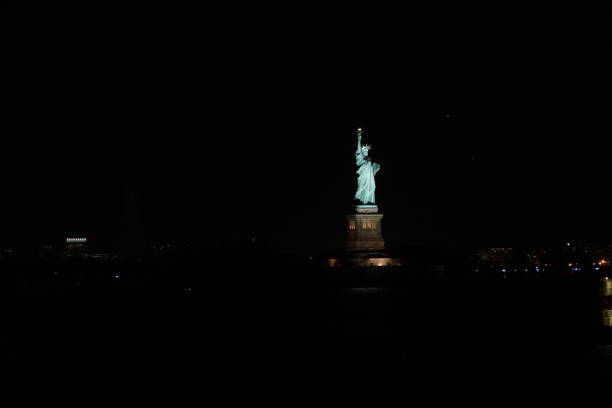 istock Statue of Liberty at night 638621600