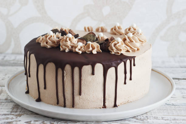 istock Chocolate cupcake with mousse cream icing on grunge 638626638
