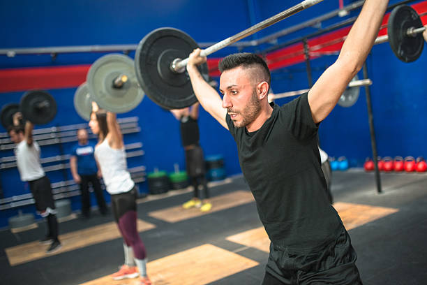 istock strong woman weightlifting a barbell 638626942