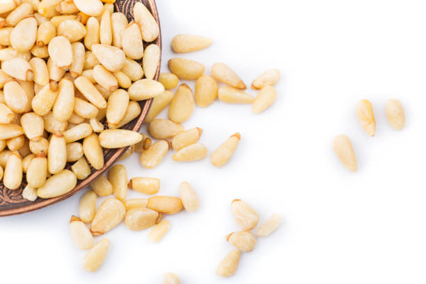 istock Salted peanuts in a brown plate. Isolated on white 638627342