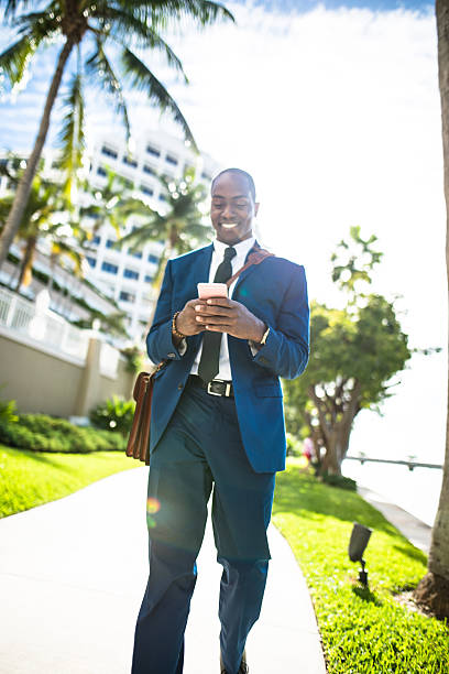 istock businessman texting in miami 638628190