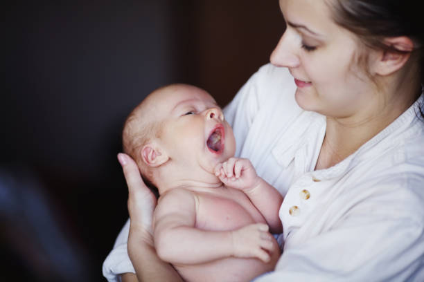 istock young mother with baby at home 638628420