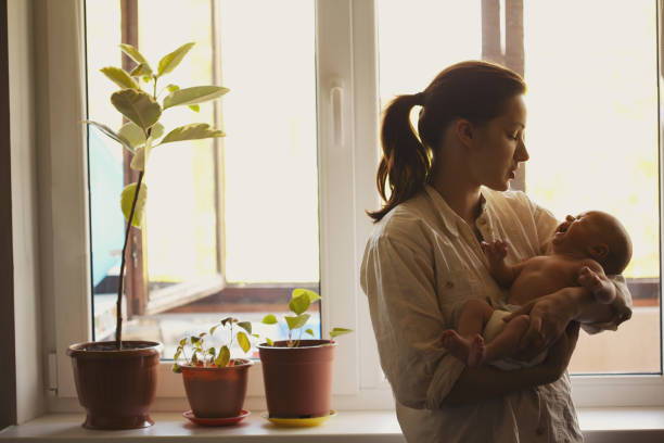 istock young mother with baby at home 638629182