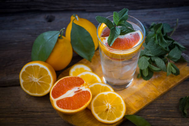 istock Fresh lemonade in a glass beaker with ice, mint, orange 638631532