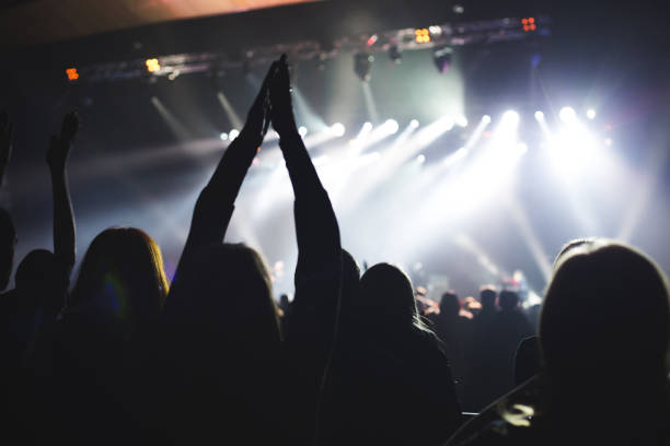 istock Audience applauded by the stage artist. 638634228