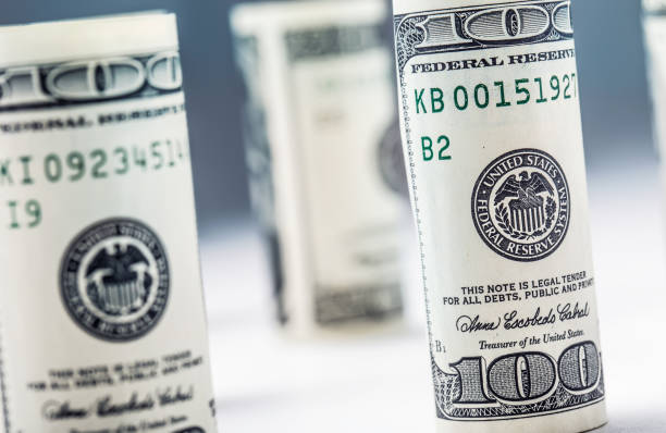 istock Dollar banknotes roll in other positions. American US currency. 638636434