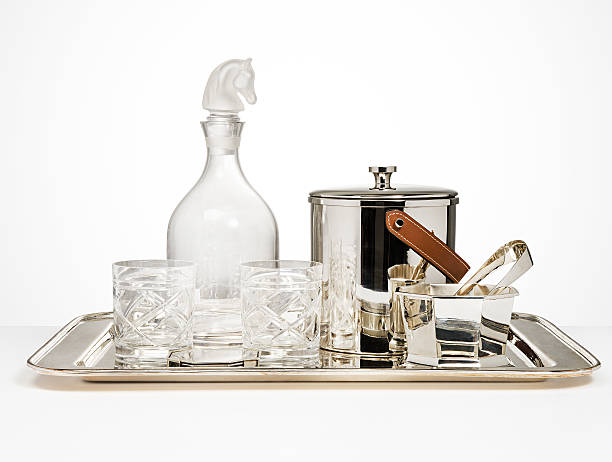 Crystal Carafe ,two glasses and silver icebox on silver tray