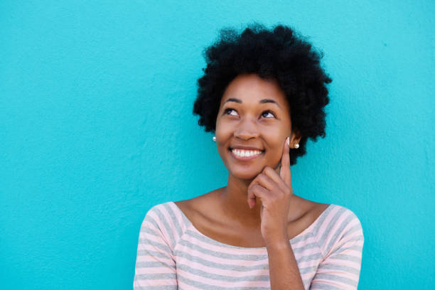 istock Cute young woman thinking and looking up 638637530