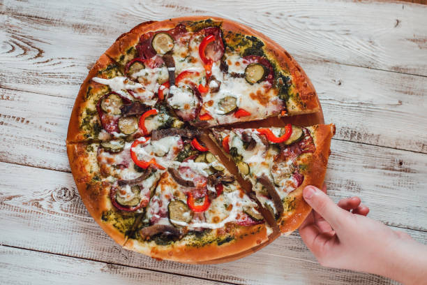 istock Delicious pizza with salami, cheese, peppers and meat. 638637706