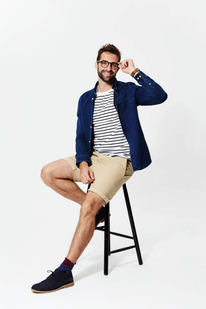 Casual man adjusts Casual man adjusts glasses, portrait adjusting seat stock pictures, royalty-free photos & images