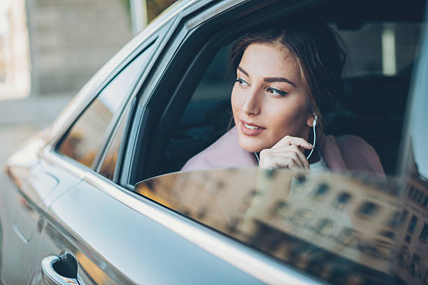 istock Beautiful woman in a car 638638252
