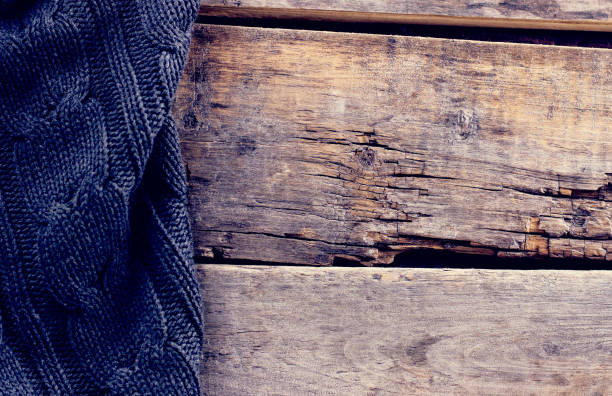 istock knitted plaid, sweater on old wooden boards 638640658