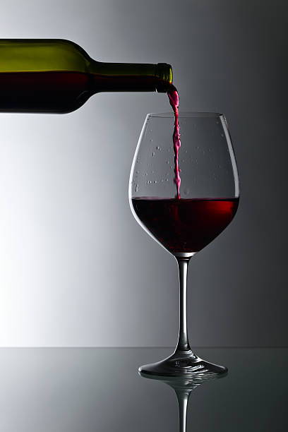 istock bottle and glass of red wine 638641548