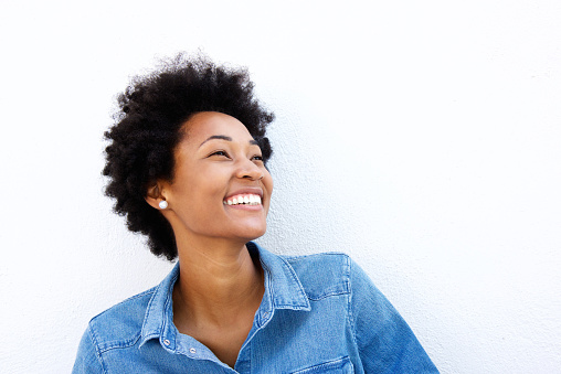 Close up portrait of smiling woman looking up on what background