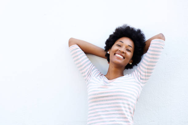 istock Carefree woman leaning back with hands behind head 638643012