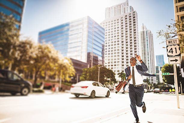 istock afro american businessman running in miami downtown 638643200