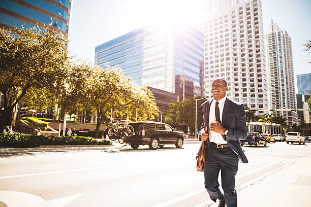 istock afro american businessman running in miami downtown 638643970