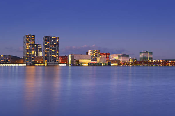Skyline of the city of Almere in The Netherlands The skyline of the city of Almere in The Netherlands, photographed from across the water at dusk. almere photos stock pictures, royalty-free photos & images