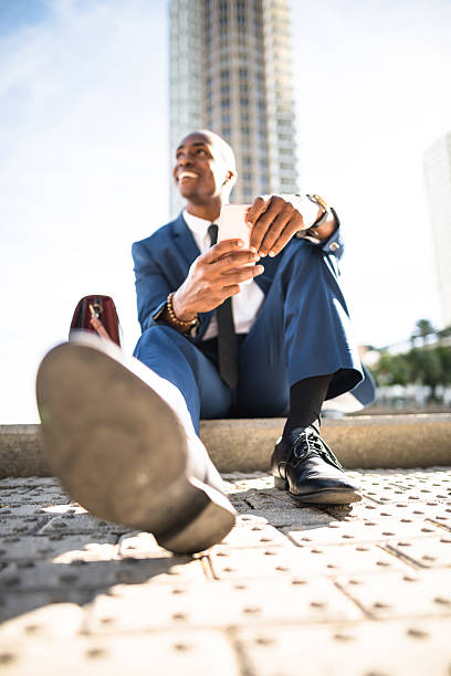 istock businessman texting in miami sitting on the park 638645124