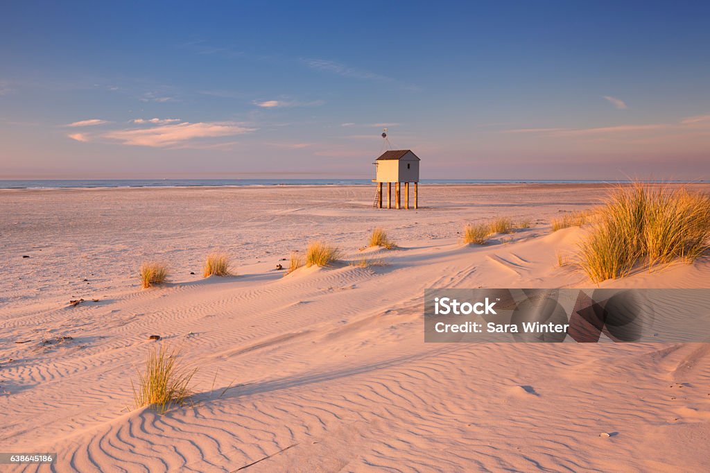 Refuge hut on Terschelling island in The Netherlands at sunset Refuge hut on the beach of the island of Terschelling in The Netherlands. Photographed at sunset. Terschelling Stock Photo