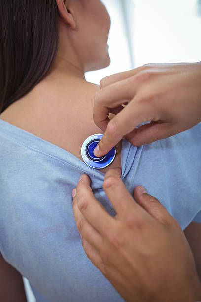 istock Doctor examining a female patient 638645510