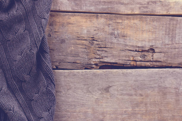 istock knitted plaid, sweater on old wooden boards 638646886