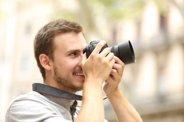 istock Man photographing with a camera in the street 638647304