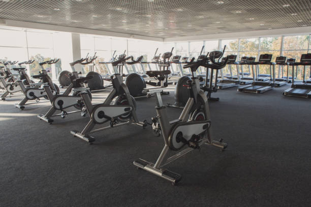 istock Modern gym interior with equipment, fitness exercise bikes 638648262