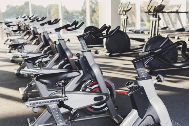 istock Modern gym interior with equipment, fitness exercise bikes 638648376