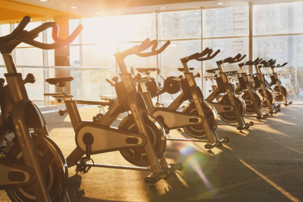 istock Modern gym interior with equipment, fitness exercise bikes 638649952