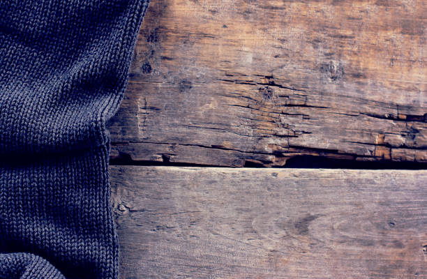 istock knitted plaid, sweater on old wooden boards 638652938