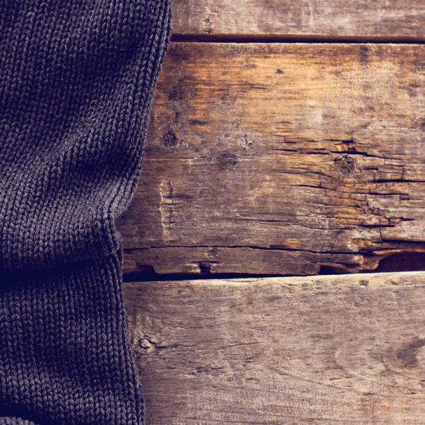 istock knitted plaid, sweater on old wooden boards 638653016