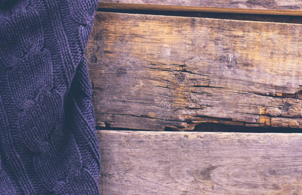 istock knitted plaid, sweater on old wooden boards 638653158
